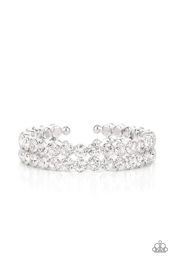 Encased in sleek silver fittings, two oversized rows of glassy white rhinestones stack into a blinding cuff around the wrist for a jaw-dropping look.  Sold as one individual bracelet.