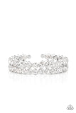Encased in sleek silver fittings, two oversized rows of glassy white rhinestones stack into a blinding cuff around the wrist for a jaw-dropping look.  Sold as one individual bracelet.