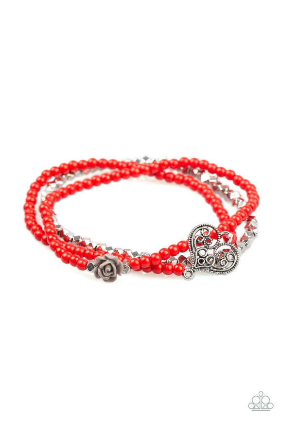 Featuring a gray resin rose and a shimmery silver heart charm, dainty red beads and faceted silver beads are threaded along stretchy bands for a vintage insp