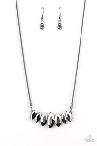 Gradually increasing in size near the center, glittery hematite marquise shaped gems link below the collar for a dramatic look. Features an adjustable clasp closure.