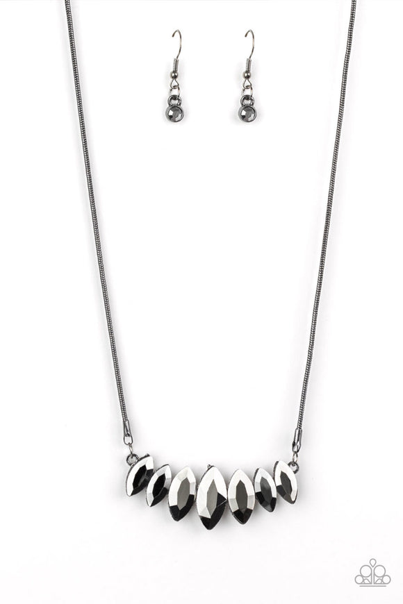 Gradually increasing in size near the center, glittery hematite marquise shaped gems link below the collar for a dramatic look. Features an adjustable clasp closure.