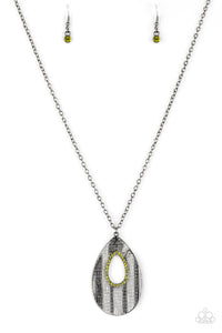 Embossed in a linear geometric pattern, a warped gunmetal teardrop swings from the bottom of a lengthened gunmetal chain. Glittery green rhinestones are encrusted around the center of the teardrop pendant for a sparkling finish. Features an adjustable clasp closure.