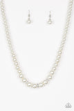 Gradually increasing in size near the center, a strand of luminescent white pearls falls just below the collar. White rhinestone encrusted rings are sprinkled along the center for a timeless finish. Features an adjustable clasp closure.  Sold as one individual necklace. Includes one pair of matching earrings.