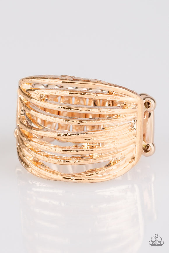 Glistening rose gold bands race across the finger, creating an airy layered band. Features a stretchy band for a flexible fit.