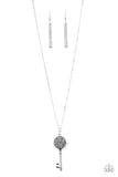 Encrusted in smoky and glittery hematite rhinestones, a sparkling silver key swings from the bottom of a lengthened silver chain for a whimsical look. Features an adjustable clasp cl