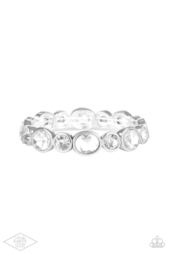 Encased in sleek silver frames, oval and round white rhinestones alternate along a stretchy band around the wrist for a timeless look.