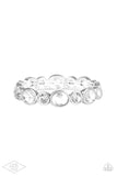 Encased in sleek silver frames, oval and round white rhinestones alternate along a stretchy band around the wrist for a timeless look.