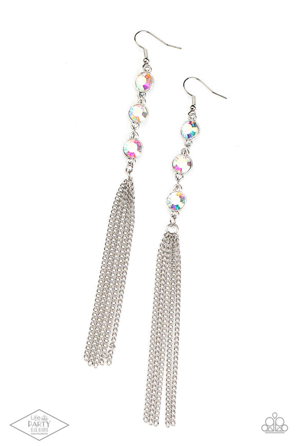 A shimmery silver chain tassel swings from the bottom of a stack of three iridescent rhinestones, creating a fabulously tiered look. Earring attaches to a standard fishhook fitting.