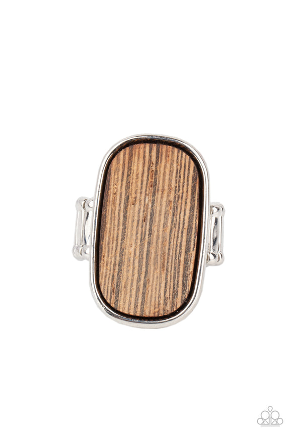 Encased in a sleek silver frame, a rustic piece of wood sits atop the finger for an unexpected refinement. Features a stretchy band for a flexible fit.