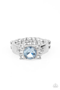 Trios of glassy white rhinestones flank an oversized Cerulean rhinestone, creating a sparkly centerpiece atop a dainty silver band. Features a dainty stretchy band for a flexible fit.