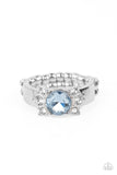 Trios of glassy white rhinestones flank an oversized Cerulean rhinestone, creating a sparkly centerpiece atop a dainty silver band. Features a dainty stretchy band for a flexible fit.