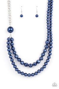 A dramatically oversized blue pearl gives way to two mismatched strands of classic blue pearls that graduate in size and imperfect finishes, adding a timeless twist to the classic pearl palette. Features an adjustable clasp closure.