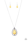 An earthy yellow stone teardrop is suspended inside an airy silver teardrop frame, creating an out-of-this-world pendant at the bottom of a shiny silver chain. Features an adjustable clasp closure.