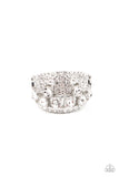 Encased in sleek silver fittings, a cluster of glittery white rhinestones coalesce inside an airy silver band encrusted in haphazard sections of glassy white rhinestones for a modern fashion. Features a stretchy band for a flexible fit.