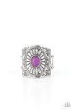 An exquisitely ornate silver band featuring engraved floral motifs is punctuated by a bright purple oval stone creating an elegant centerpiece atop the finger. Features a stretchy band for a flexible fit.