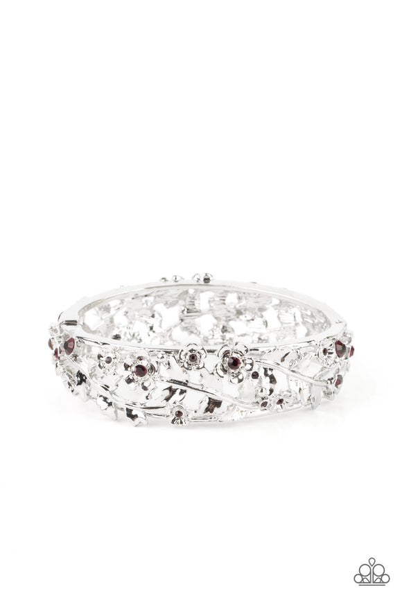 Dotted with dainty purple rhinestone centers, flowering leafy silver vines bloom into two oversized silver frames that delicately hinge into a versatile bangle-like bracelet. Features a hinged closure.