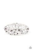Dotted with dainty purple rhinestone centers, flowering leafy silver vines bloom into two oversized silver frames that delicately hinge into a versatile bangle-like bracelet. Features a hinged closure.