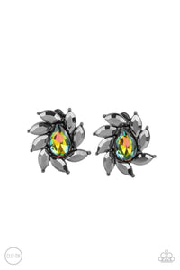 A faceted oil spill teardrop gem is encompassed by a radiating frame of sparkling hematite marquise rhinestones set in gunmetal pronged fittings creating a dramatically vintage finish. Earring attaches to a standard clip-on fitting.