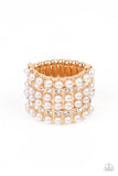 Dainty rows of bubbly pearls and glassy white rhinestones alternate across the front of a thick gold band, creating a vintage inspired statement piece. Features a stretchy band for a flexible fit.
