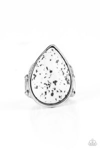 A generous polished white stone infused with black flecks is encased in a simple silver teardrop frame resulting in a seasonal finish atop the finger. Features a stretchy band for a flexible fit.