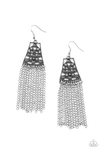 Rows of Ultimate Gray beads set inside diamond shaped frames coalesce with dainty sunburst embellishments inside an airy dotted silver flared frame. A row of silver chain fringe sways across the bottom creating an anciently inviting allure. Earring attaches to a standard fishhook fitting.