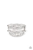 The front of a silver oval frame is encrusted in stacked rows of emerald and round cut white rhinestones, coalescing into a blinding centerpiece atop the finger. Features a stretchy band for a flexible fit.<br data-mce-fragment="1">