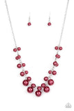 Gradually increasing in size, clusters of red pearls alternate with dainty silver bars below the collar, creating a bubbly fringe. Features an adjustable clasp closure.