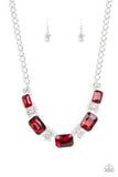 Featuring a fiery finish, an oversized collection of emerald cut red rhinestones link with rhinestone dotted teardrop rhinestone frames below the collar for a jaw-dropping display. Features an adjustable clasp closure.
