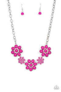 A flirtatious collection of Fuchsia Fedora dotted floral frames alternate with dainty opaque Fuchsia Fedora flowers below the collar, creating a vivacious pop of color. Features an adjustable clasp clos