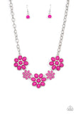 A flirtatious collection of Fuchsia Fedora dotted floral frames alternate with dainty opaque Fuchsia Fedora flowers below the collar, creating a vivacious pop of color. Features an adjustable clasp clos