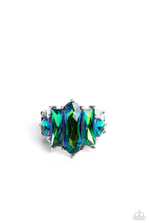 Featuring a stellar UV finish, an iridescent collection of triangular, emerald, and oval cut green rhinestones are encrusted across the center of a thick silver band for an out-of-this-world fashion. Features a stretchy band for a flexible fit. Due to its prismatic palette, color may vary.