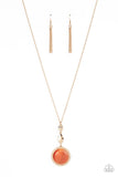 Encased in a hammered gold frame, an oversized orange cat's eye stone pendant swings from the bottom of hammered square and marquise shaped frames that are suspended from an extended gold chain, resulting in a magical centerpiece. Features an adjustable clasp closure.