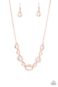 Three sparkly white rhinestone encrusted rose gold frames link with shiny rose gold ovals below the collar, resulting in a classy refinement. Features an adjustable clasp closure.