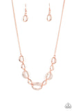 Three sparkly white rhinestone encrusted rose gold frames link with shiny rose gold ovals below the collar, resulting in a classy refinement. Features an adjustable clasp closure.