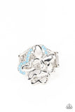 Enhanced with blue opal rhinestones, a shiny collection of mismatched silver butterfly frames flutters atop the finger, resulting in a whimsical bouquet. Features a stretchy band for a flexible fit.