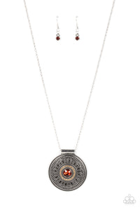 Encircled in a dainty ring of golden topaz rhinestones, an oversized topaz rhinestone is pressed into the center of a silver medallion that is abloom with a studded floral motif. The flowery pendant glides along an extended silver chain, resulting in a radiant pendant. Features an adjustable clasp closure.