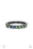 Infused with dainty gunmetal beads, glittery oil spill rhinestone encrusted frames are threaded along stretchy bands around the wrist for a glamorous look.