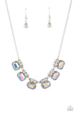 Featuring an iridescent UV finish, silvery rhinestones are crowned in pairs of glassy white rhinestones as they delicately link below the collar for an out-of-this-world sparkle. Features an adjustable clasp closure.