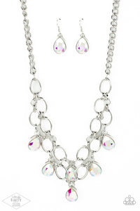 Joined by dainty silver links, two rows of dramatic silver chain layer below the collar in a fierce fashion. Iridescent teardrop gems drip from the glistening layers, adding a timeless shimmer to the show-stopping piece. Features an adjustable clasp closure.