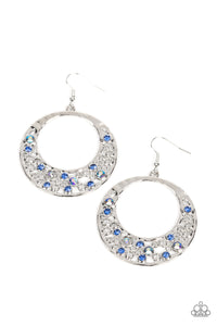 A glittery collection of blue and iridescent rhinestones joins with dainty silver circles along the bottom of a hammered silver frame, bubbling into an extravagant effervescence. Earring attaches to a standard fishhook fittin
