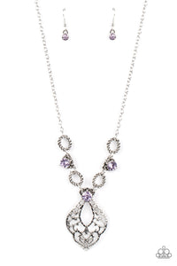 Twisted silver links and oversized purple rhinestones delicately alternate below the collar. A hammered filigree filled silver pendant shimmers from the bottom of the centermost rhinestone, creating a contemporary pendant. Features an adjustable clasp closure.