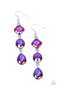 Featuring a stellar UV finish, three iridescent pink rhinestones delicately link into a refined lure. Featuring teardrop, round, and emerald style cuts, the sparkly rhinestones are delicately encased in silver frames, adding a layer of sophisticated shimmer to the glamorous look. Earring attaches to a standard fishhook fitting. Due to its prismatic palette, color may vary.