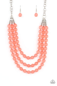 Attached and separated by shiny silver beads, three rows of alternating coral striped acrylic beads layer across the collar creating a colorful canvas. Features an adjustable clasp closure.