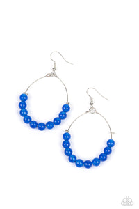Blue stones are threaded along dangling silver hoops, evoking a trendy laidback design. Earring attaches to a standard fishhook fitting.