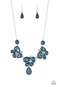 Draped elegantly across the chest, clusters of geometric blue gems, brushed in the fall Pantone® of Midnight, gather around sparkling white rhinestones, creating a bright and beautiful pattern. Features an adjustable clasp closure.