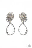 An explosion of radiating silver bars is topped with a sprinkle of iridescent rhinestones, creating a stellar anchoring point. Swinging below the starburst, an oversized, clear teardrop with a light-catching, faceted surface is wrapped in a textured border of silver, adding stunning dimension and refinement to the cosmic combination. Earring attaches to a standard post fitting. Due to its prismatic palette, color may vary.   Featured inside The Preview at Made for More! Sold as one pair of post earrings.