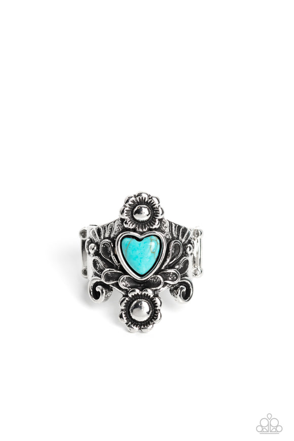 Dotted with a refreshing turquoise heart stone center, glistening silver floral filigree climbs up and down the finger, coalescing into a whimsical, earthy frame. Features a stretchy band for a flexible fit. As the stone elements in this piece are natural, some color variation is normal.