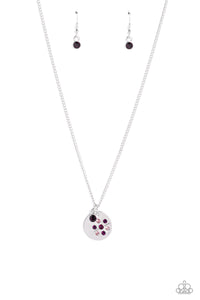 <p>Falling from a dainty silver chain, a silver disc is embossed with rhinestones in shades of amethyst, and purple, that encircle around a dandelion stamped shape. Gliding next to the silver disc, a solitaire amethyst rhinestone set in a silver frame adds an additional pop of color to the whimsical design. Features an adjustable clasp closure.</p> <p><i> Sold as one individual necklace. Includes one pair of matching earrings.</i></p>