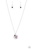 <p>Falling from a dainty silver chain, a silver disc is embossed with rhinestones in shades of amethyst, and purple, that encircle around a dandelion stamped shape. Gliding next to the silver disc, a solitaire amethyst rhinestone set in a silver frame adds an additional pop of color to the whimsical design. Features an adjustable clasp closure.</p> <p><i> Sold as one individual necklace. Includes one pair of matching earrings.</i></p>
