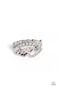 A row of sleek silver daisies with pink opalescent centers curls up the finger for a whimsical floral arrangement. Curls of silver dotted with dainty white rhinestones frames the floral display for additional subtle color. Features a dainty stretchy band for a flexible fit